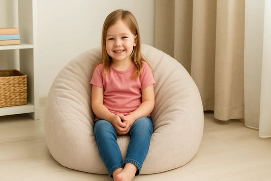 ChatGPT의 말: A young girl sits comfortably on a beige bean bag chair in a cozy room, smiling warmly—perfect for showcasing top kids' seating picks in 2025.